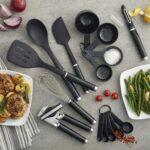 A complete 15-piece black kitchen tool and gadget set arranged neatly, showcasing all included utensils.