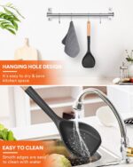 Black silicone wok spatula with a wooden handle, designed for nonstick pans and cooking