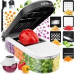 White and black fullstar Pro Core 6-in-1 Vegetable Chopper and Mandoline Slicer with various blades and container.