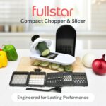 White and black fullstar Pro Core 6-in-1 Vegetable Chopper and Mandoline Slicer with various blades and container.