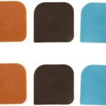 A set of six square nylon pan scrapers in black, red, and brown colors, displayed neatly for kitchen cleaning.