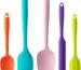 A set of five multicolor silicone spatulas with stainless steel cores, arranged for a kitchen product display.