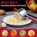 A red Minteem 15oz potato ricer made of stainless steel, shown with its silicone handle, ready for mashing.