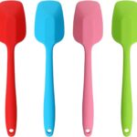 A set of four MOACC multicolor silicone spatulas with rubber and stainless steel handles, arranged neatly on a clean surface.