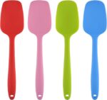 A set of four MOACC multicolor silicone spatulas with rubber and stainless steel handles, arranged neatly on a clean surface.