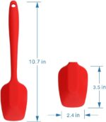 A set of four MOACC multicolor silicone spatulas with rubber and stainless steel handles, arranged neatly on a clean surface.
