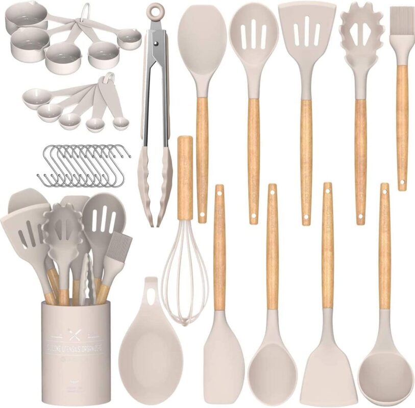A complete 33-piece Umite Chef kitchen utensil set with khaki silicone heads and wooden handles, displayed with a holder and