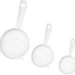 Three white plastic fine mesh strainers with handles, nested together, against a plain background.